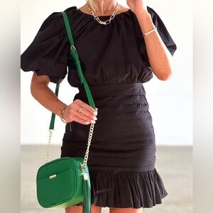Cap sleeve black mini dress, with a ruffle bottom